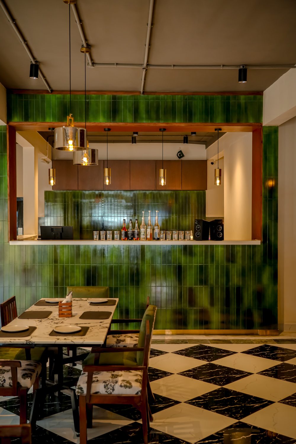 The green-tiled bar