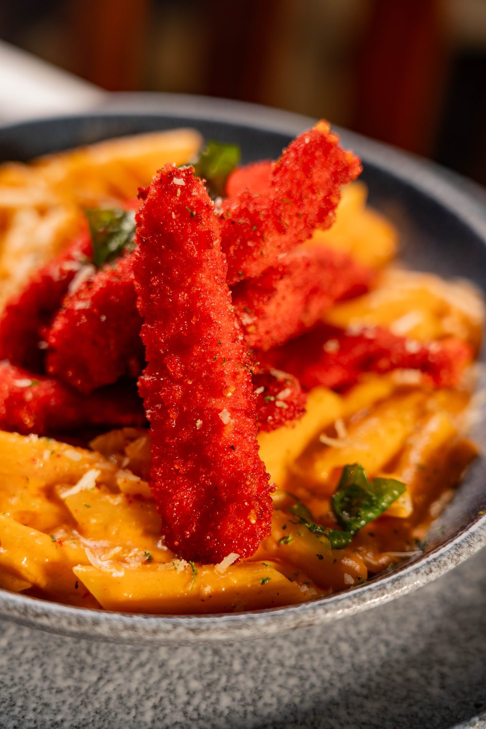 Penne in a chilli Parmesan cream with Cheeto-crusted chicken strips